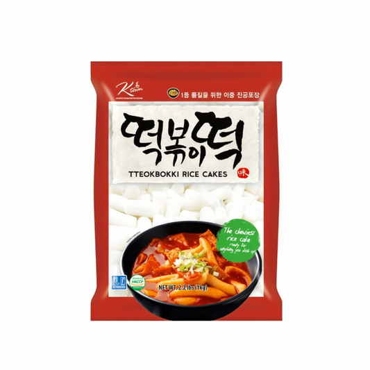 Packaged teokbokki rice cakes with a bowl of rice cake on a white background, featuring the brand 'Korean'.