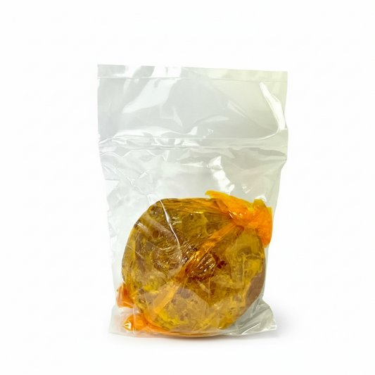 Packaged hardened brown sugar candy with a visible brand label on a white background