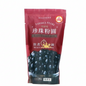 Red package of tapioca pearls with black sugar flavor on a white background